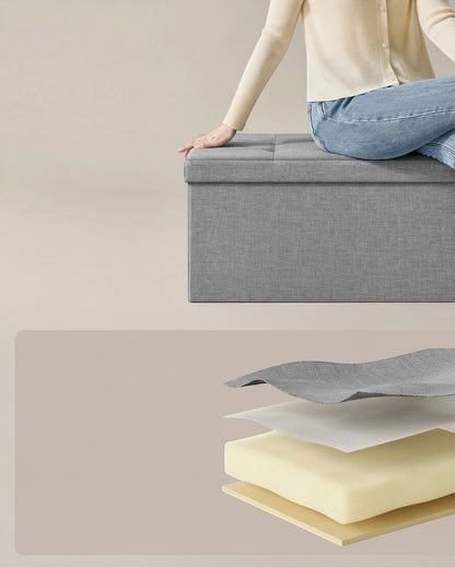 Tokari opvouwbare grijze opbergbank met imitatielinnen bekleding en gedetailleerde weergave van de schuimvulling.