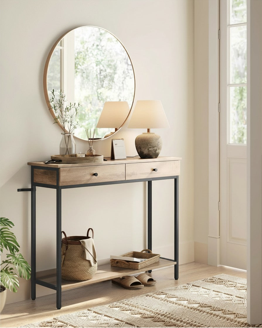 Tokari wandtafel met twee lades en onderrek in warme houtlook met zwart metalen frame in een stijlvolle hal.